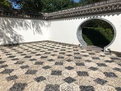 08B The Moon Gate with white and black pebbles from China are featured in the Northern Terrace in the Chinese Garden Royal Botanical Hope Gardens Kingston Jamaica